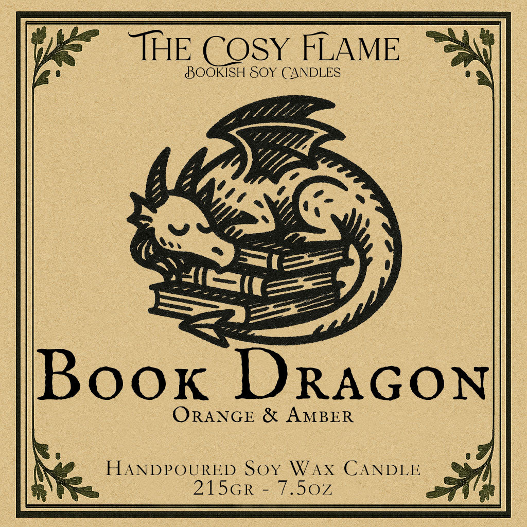 Book Dragon candle label design by The Cosy Flame, featuring an illustration of a small dragon curled up on a stack of books, featuring the scents orange and amber.