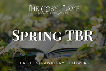 Label design for The Cosy Flame bookish soy candle named Spring TBR, featuring the scents peach, strawberry and flowers.