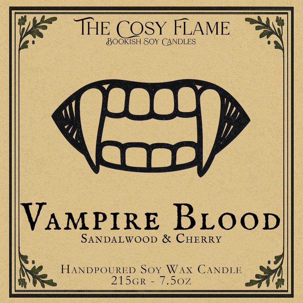 Vampire Blood candle label design by The Cosy Flame, featuring an illustration of a vampire mouth with fangs, featuring the scents sandalwood and cherry.