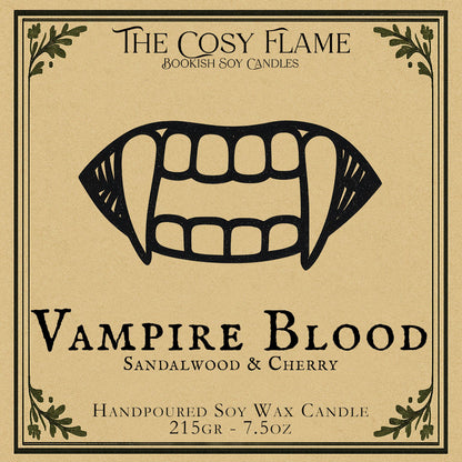 Vampire Blood candle label design by The Cosy Flame, featuring an illustration of a vampire mouth with fangs, featuring the scents sandalwood and cherry.